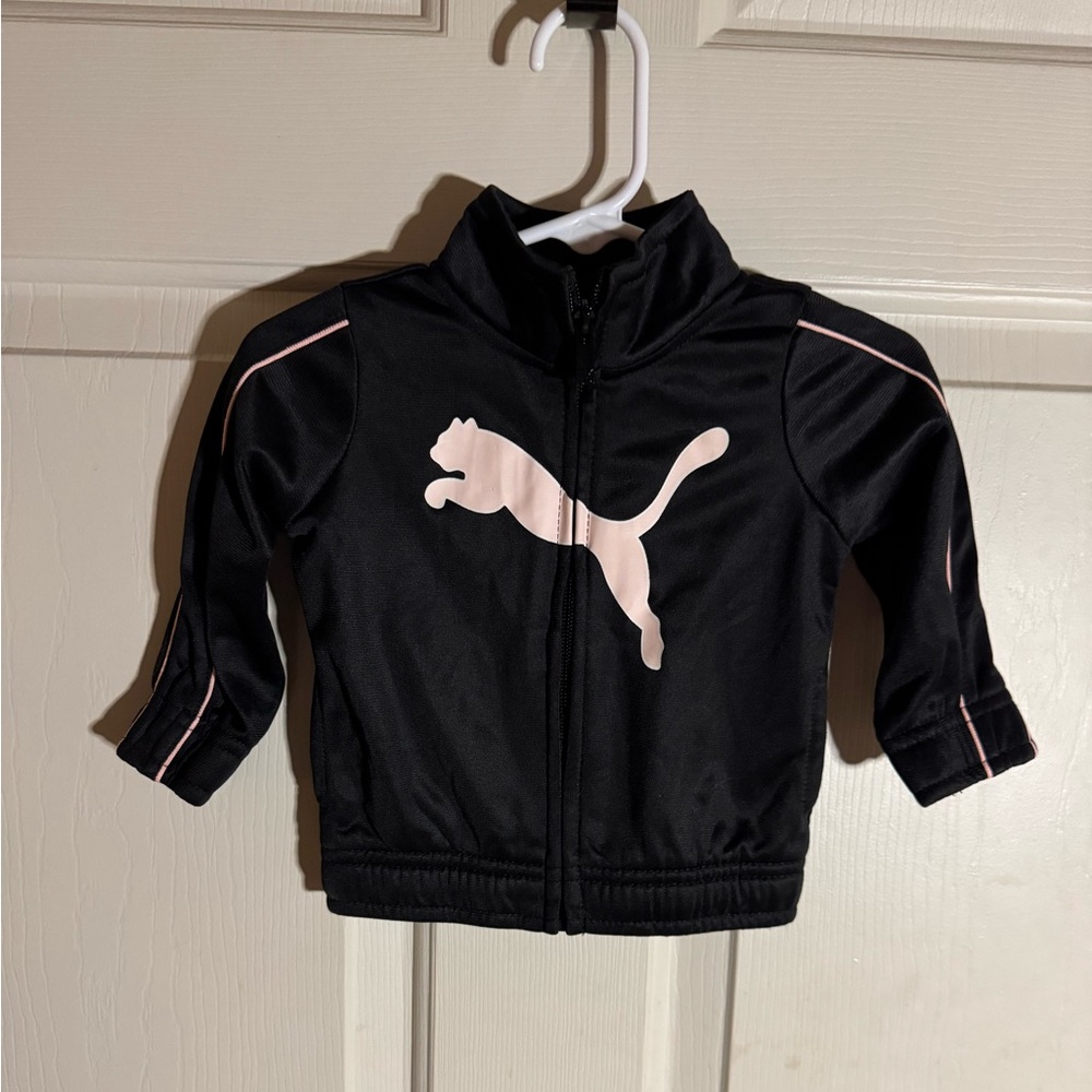 Puma brand little girls black jacket with a pink puma on the front.